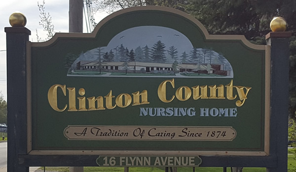 Sign outside of Nusing Home building that reads Clinton County Nursing Home, A tradition of Caring Since 1874, 16 Flynn Avenue