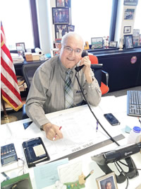 John Zurlo Clinton County Clerk sitting at his desk in his office
