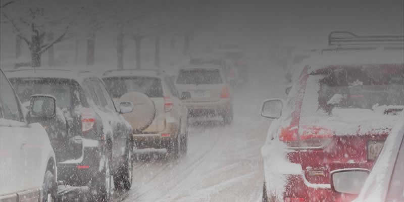 Cars driving during a snow storm